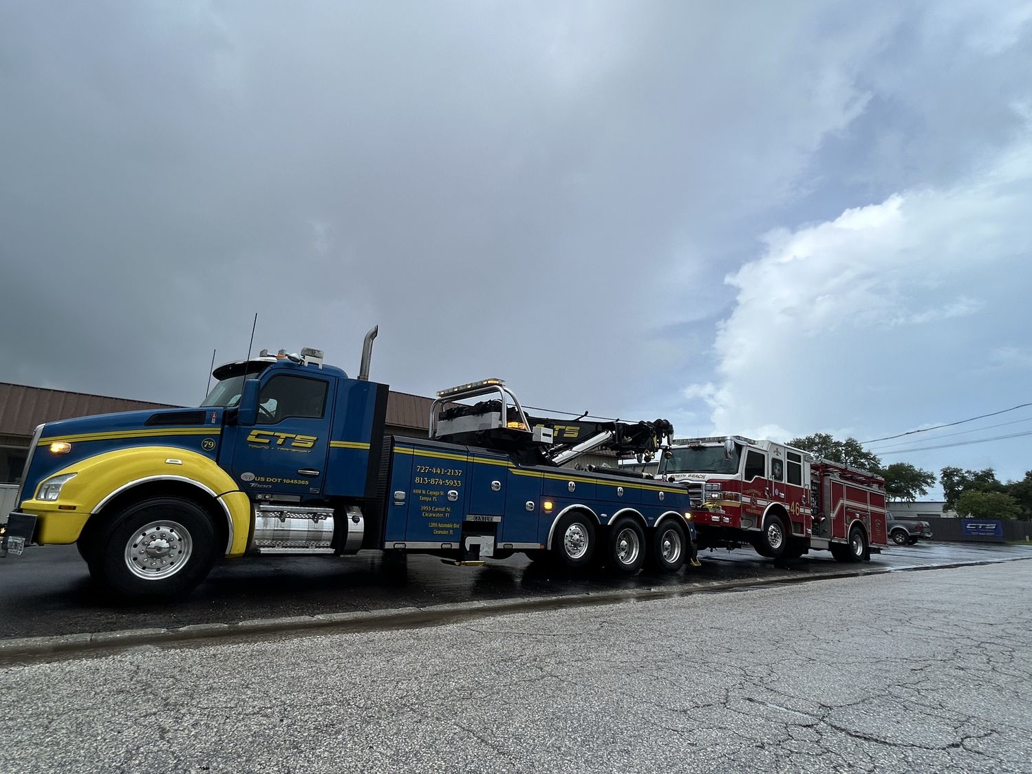 CTS heavy-duty wrecker towing a fire engine