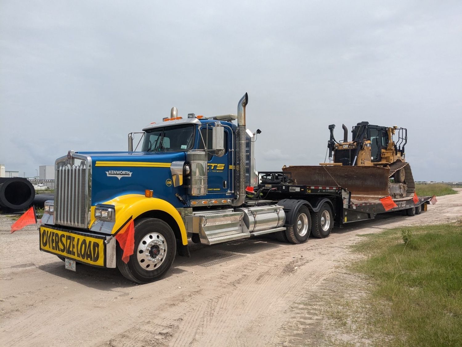 CTS Landoll hauling a Caterpillar dozer