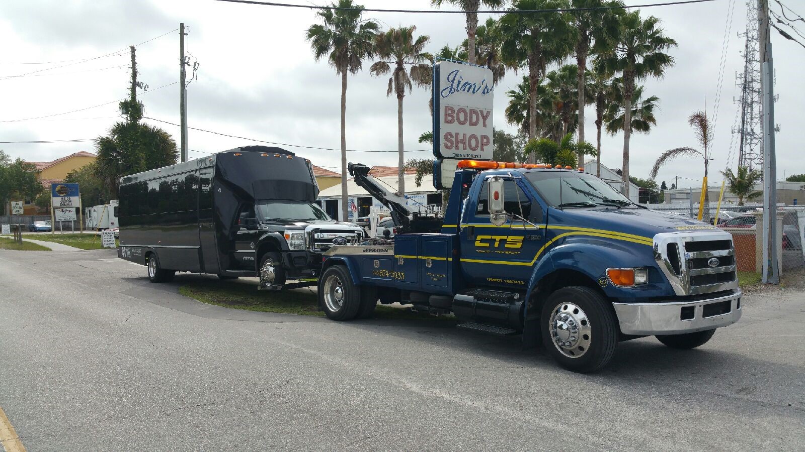 Medium Duty Party Bus being towed by CTS Tow Truck
