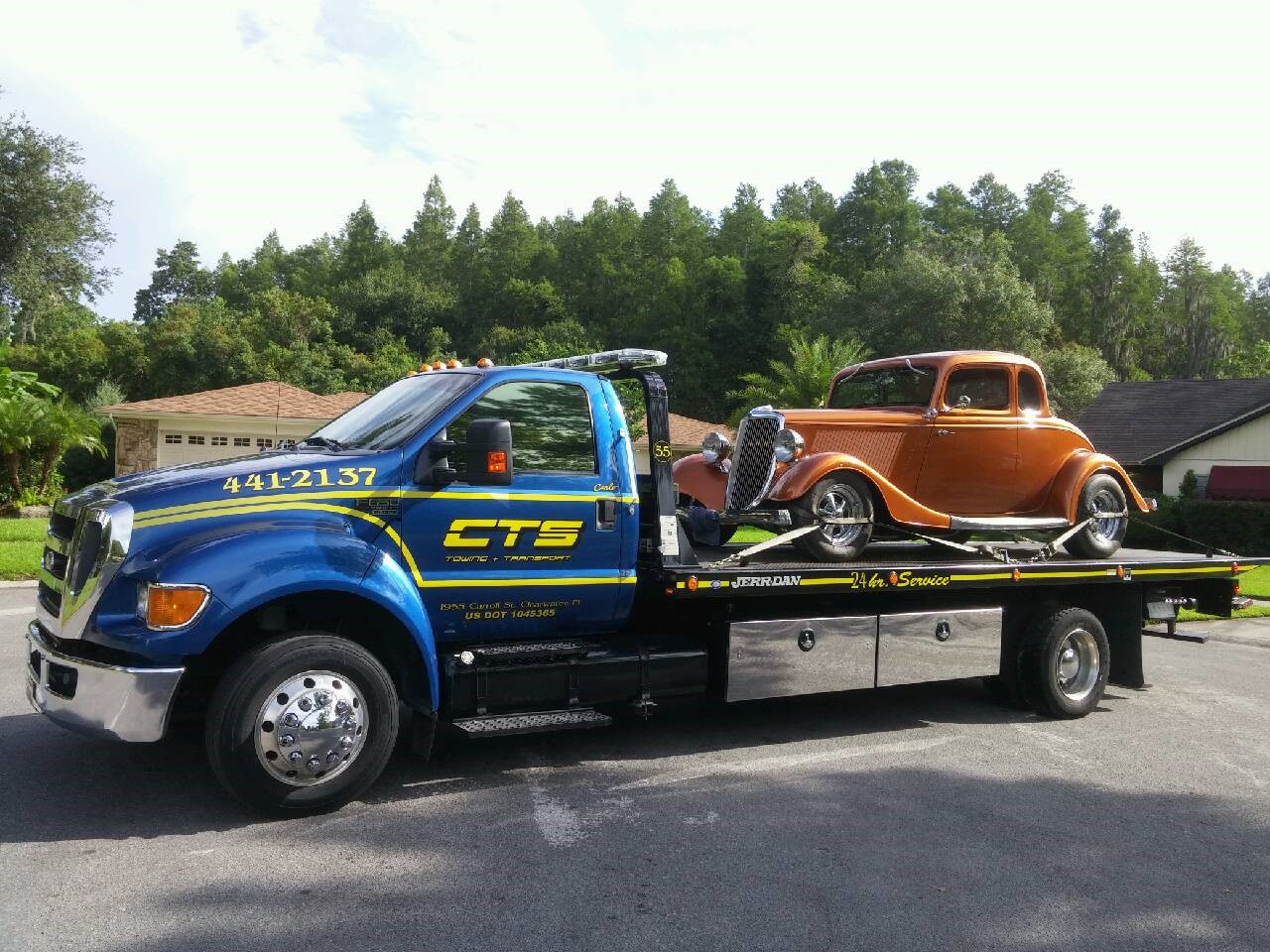 1934 Ford Coupe on a rollback CTS Tow Truck