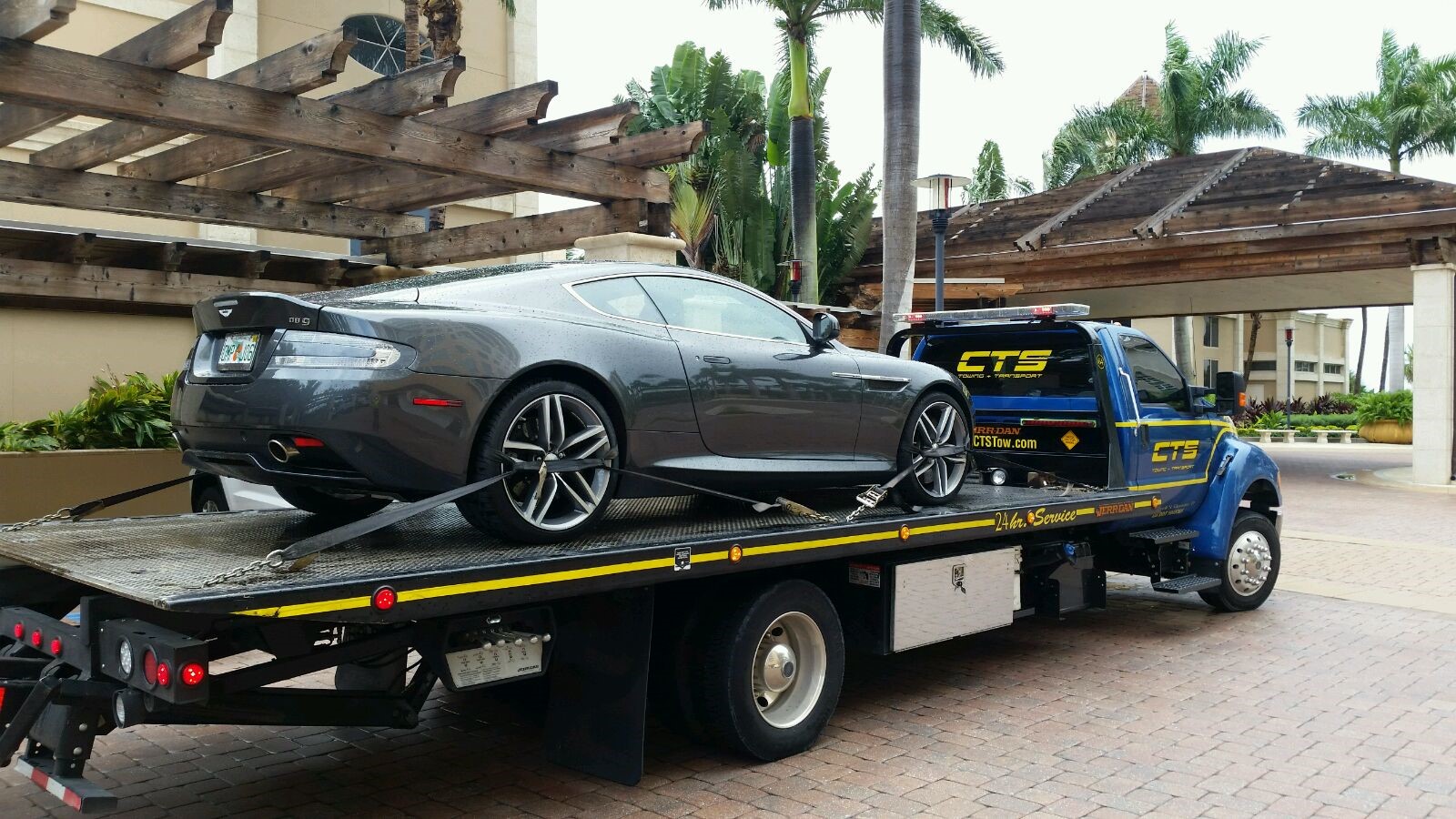Aston Martin on a rollback CTS Tow Truck
