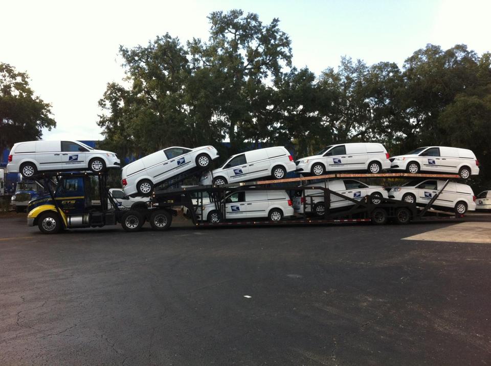 8 Postal cars on a CTS Tow Truck