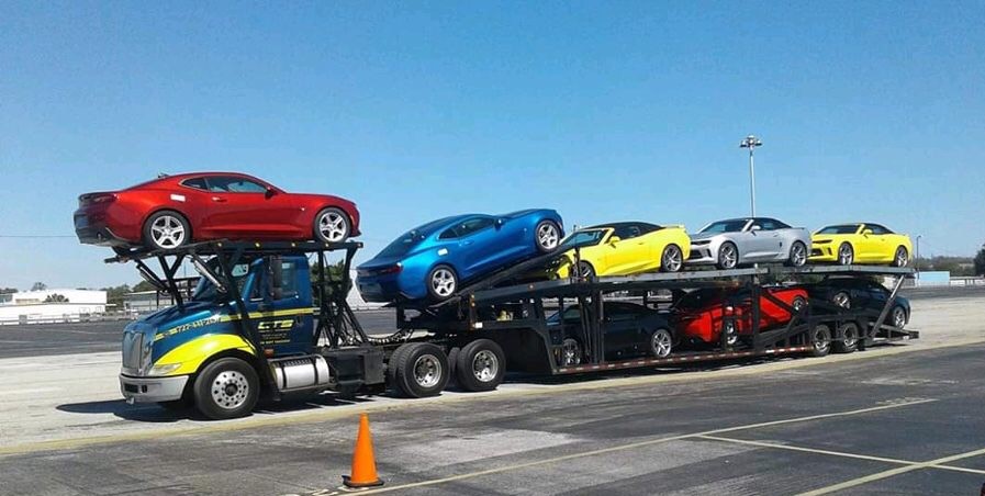 8 Car Hauler Transporting a Load of Cameros - Commercial Towing