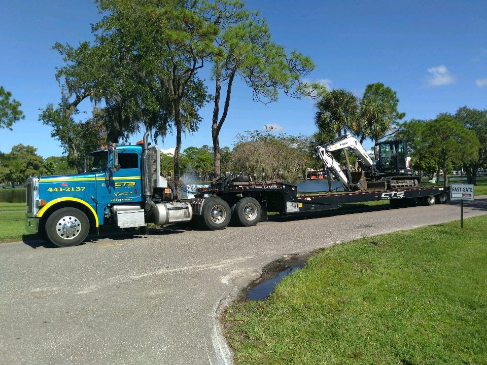 Landoll 660 Trailer Transporting a Bobcat Mini Excavator - Commercial Towing