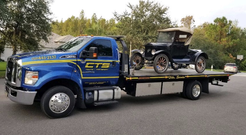 Rollback towing a 1925 Ford Model T