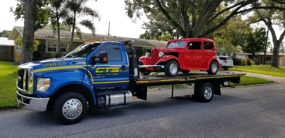 Rollback towing a coupe - Light Duty